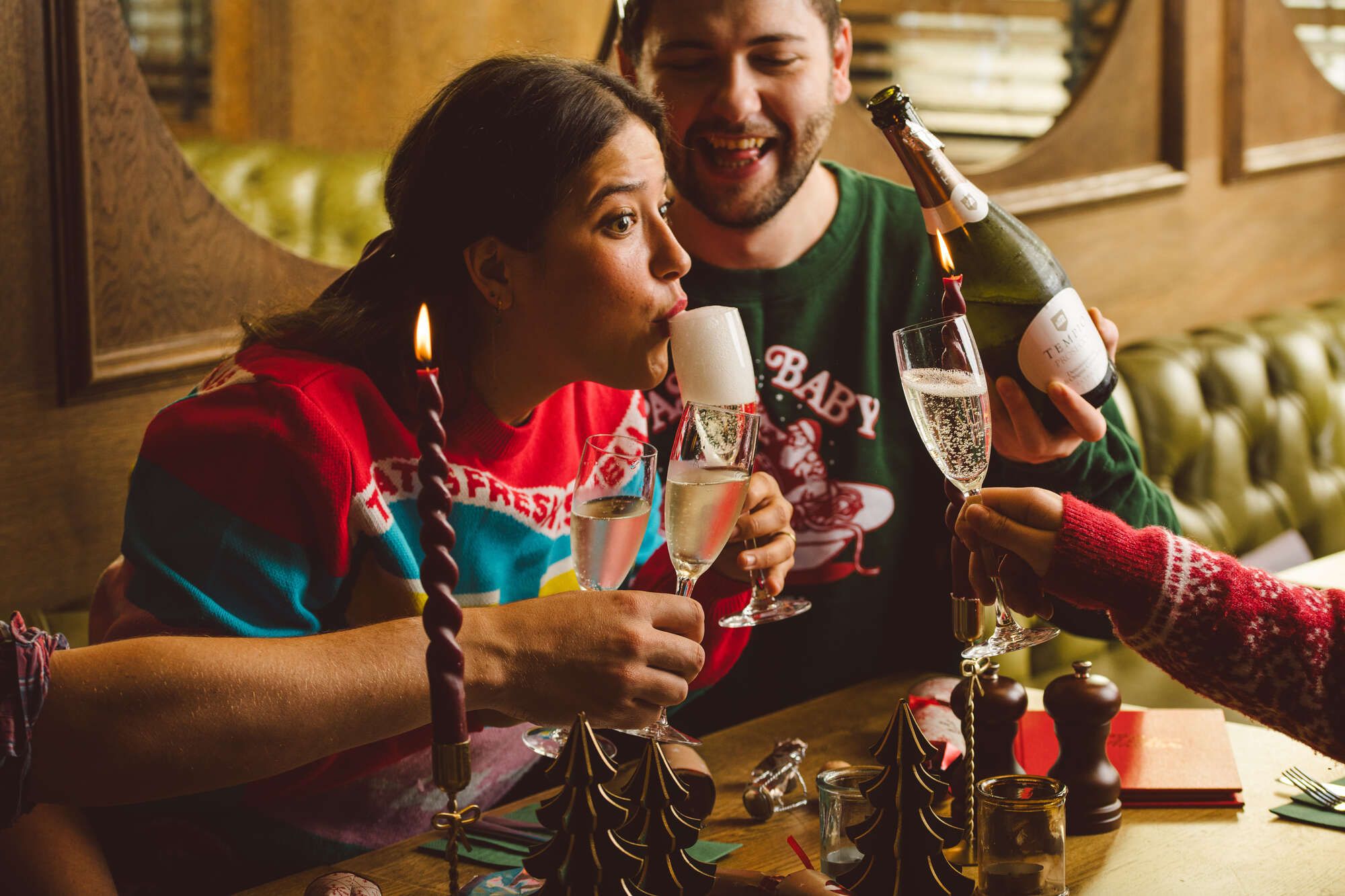 Friends enjoying festive food and drinks at The Hope & Anchor in Brixton, London